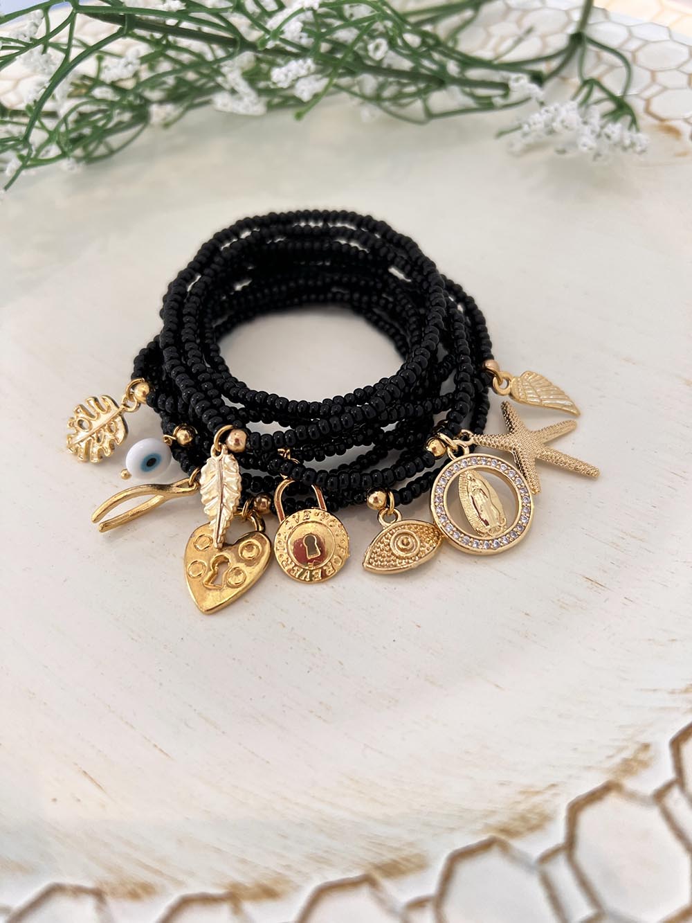 Set of Black Bracelets with Charms